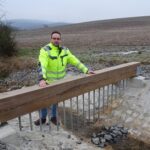 Baumaßnahmen gegen Überflutungen abgeschlossen: Rasenweg im Stadtteil Hausen ist jetzt besser geschützt