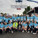 Mit Fairtrade-Power durch den Regen: Das Landratsamt Würzburg beim Firmenlauf in Eibelstadt